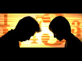 Business People Bow to One Another as Stock Quotes Scroll By