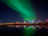 Aurora Borealis over a Town  Njardvik  Iceland