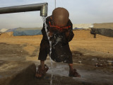 Refugee Washes His Face in a Refugee Camp in the Outskirts of Kabul  Afghanistan
