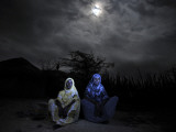 Halima Aden  Left  and Rhadija Aden  Sit Next to their Home in Garissa  Eastern Kenya