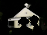 Amish Men in Front of the Schoolhouse Where a Gunman Shot Several Students and Himself