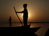 Boatman Prepares to Anchor His Boat  after the Day's Work in River Ganges  in Allahabad  India