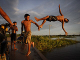 Youths Play in a Lagoon Near the Eastern Beni State Capital of Trinidad  Bolivia