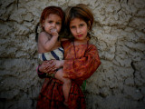 Afghan Girl Holds Her Younger Sister in Nangarhar Province  East of Kabul  Afghanistan