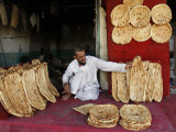 Baker Arranges Breads at His Shop in Kandahar Province  South of Kabul  Afghanistan