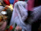Bride Sits Next to Groom During a Mass Marriage Ceremony for About 50 Couples in Amritsar  India