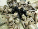 Children Lie in Sludge as a Ritual to Induce Rain in Nari Bari  India