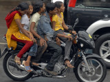 Boy Rides a Motorbike with Four Girls  as it Drizzles in Hyderabad  India