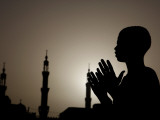 Sudanese Muslim Boy Prays in Front of a Mosque in Sudan