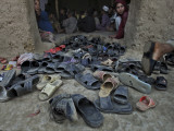 Afghan Refugee Children Look Out of the Mosque During a Daily Quran Class