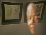 Lithograph by Nelson Mandela is Seen Reflected on a Photographic Portrait of Mandela