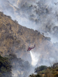Helicopter Makes a Water Drop as Firefighters Battle a Wildfire in the San Gabriel Mountains