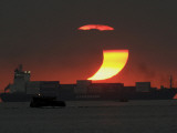 Partial Solar Eclipse as the Sun Sets at Manila's Bay  Philippines