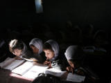 Afghan School Girls Read their Lessons at the Aziz Afghan Secondary School in Kabul  Afghanistan