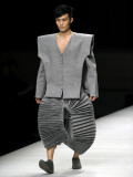 Model on Stage Displaying a Creation by Chinese Fashion Designer Ye Yaoya  Fashion Week in Beijing