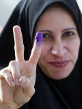 Iraqi Woman Holds Up Her Purple Finger  Indicating She Has Just Voted in Southern Iraq