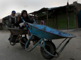 Children Push a Wheelbarrow as They Return Home in the Outskirts of Kabul  Afghanistan