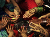 Christian Girls Paint their Hands with Henna Paste in Preperation for Easter Holiday in Pakistan