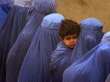 Afghan Women Wearing Burqas Line Up to Vote at a Polling Station in Kabul