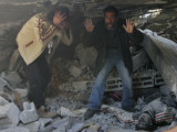 Palestinians Next to a Body  Killed During the Israeli Army Operation in Gaza