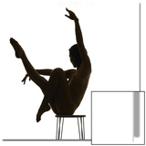 Woman Balancing on Chair and Doing Yoga
