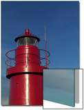 A Red Lighthouse with Blue Sky