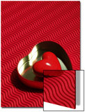 Heart Shaped Box Containing a Love Stone with Strong Red Background