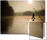 Lake View with the End of Two Fishing Rods and a Frog Immitation Lure