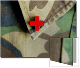 Red Cross on the Collar of a Camouflage Jacket