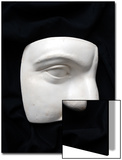 A Cut Out of a Sculpture Including a Man's Face
