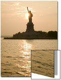 Sun Setting Behind the Statue of Liberty on a Summer Evening