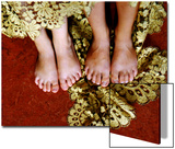 Two Pair of Feet of Small Children with Textile Spread around Them