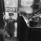 A Driver Climbing in to His Cab