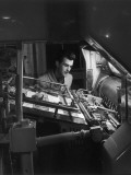Printing Machine Operator Checks a Proof