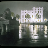 A Girl Stands in Trafalgar Square at Night