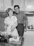 Mid Adult Couple in Kitchen  Woman Preparing Salad