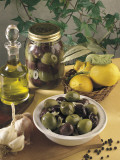 Close-Up of Olives with Garlic and a Bottle of Olive Oil