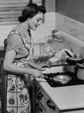 Woman Cooking in Frying Pan on Stove