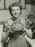 Portrait of Mature Woman Holding Pie