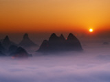 China  Guangxi Province  Yangshuo  Li River Area  Karst Hills Above Clouds at Sunrise