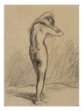 Femme nue  debout et vue de dos  mettant sa chemise