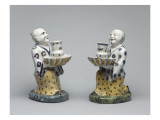 Statuettes de chinois à genoux présentant un chandelier