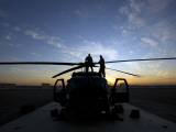 A UH-60 Black Hawk Helicopter on the Flight Line at Sunset