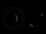 Uranus and Most of its Nine Major Rings Along with the Distant Sun and an Inner Satellite