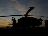 A UH-60 Black Hawk Helicopter on the Flight Line at Sunset