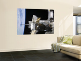 A Docked Soyuz Spacecraft over the Docked Space Shuttle Atlantis