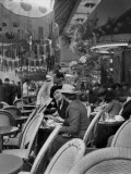 Women Relaxing at a Sidewalk Cafe