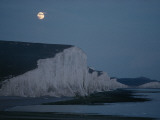 A Midsummer Moon Hangs over Chalk Cliffs