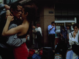A Passionate Couple Dance the Tango on a South American Street Corner