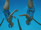 Elderly Members of a Synchronized Swimming Team Practice in a Pool